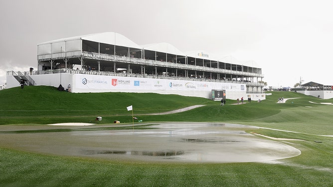 Detail of the 18th green as rain falls during a weather delay at the Pro-am to the WM Phoenix Open at TPC Scottsdale on February 07, 2024 in Scottsdale, Arizona.
