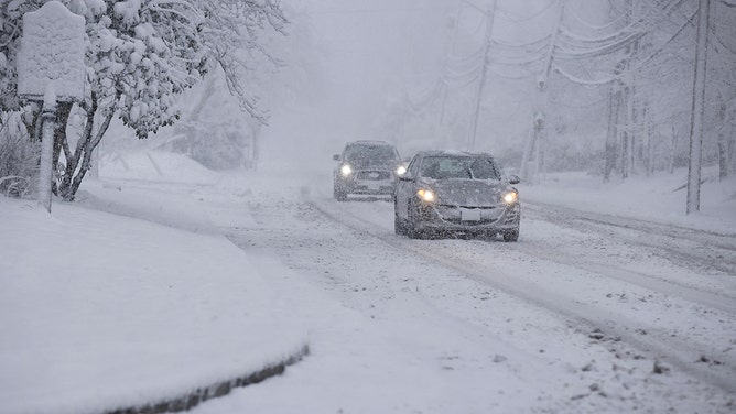 Commuters drive through snow in Norwood, New Jersey, on February 13, 2024.