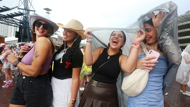 Taylor Swift fans, also known as "Swifties", brave wild weather outside Accor Stadium for Taylor Swift's first Sydney concert on February 23, 2024 in Sydney, Australia.