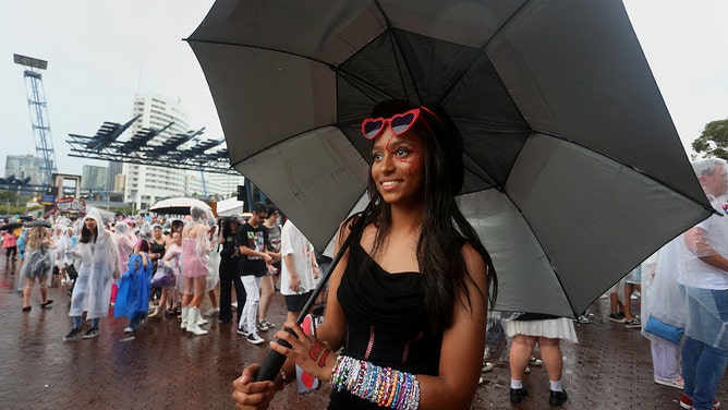Taylor Swift fans, also known as "Swifties", brave wild weather outside Accor Stadium for Taylor Swift's first Sydney concert on February 23, 2024 in Sydney, Australia.