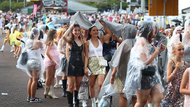 Taylor Swift fans, also known as "Swifties", brave wild weather outside Accor Stadium for Taylor Swift's first Sydney concert on February 23, 2024 in Sydney, Australia.