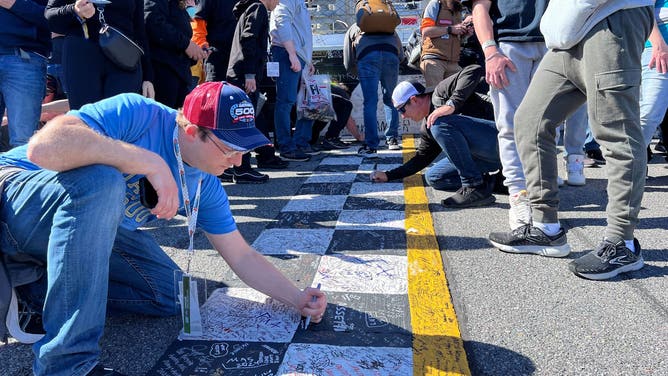 Scenes from the 66th annual Daytona 500 at Daytona International Speedway in Florida on Feb. 19, 2024. Florida storms caused officials to delay the race until Monday afternoon.