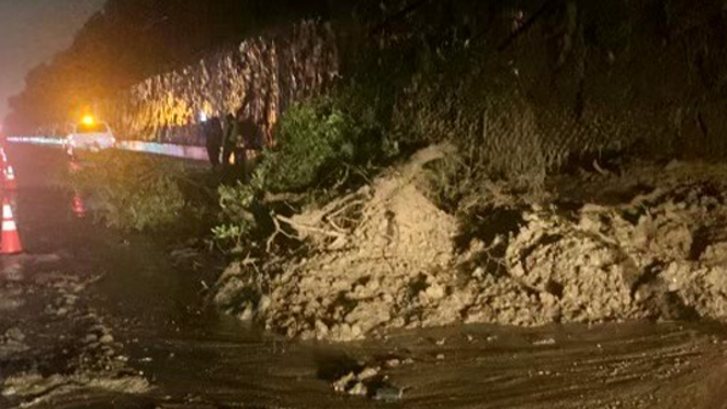 The right lane of the southbound Interstate 405 just before the Sunset Boulevard off-ramp in Los Angeles was closed early Monday morning after a mudslide. Torrential rain from an atmospheric river storm has slammed Southern California leading to widespread flooding.