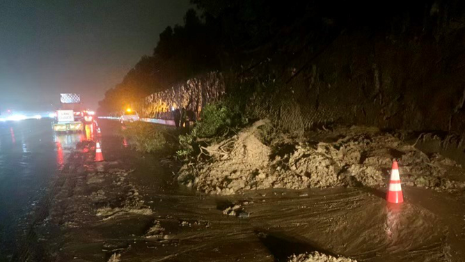 The right lane of the southbound Interstate 405 just before the Sunset Boulevard off-ramp in Los Angeles was closed early Monday morning after a mudslide. Torrential rain from an atmospheric river storm has slammed Southern California leading to widespread flooding.