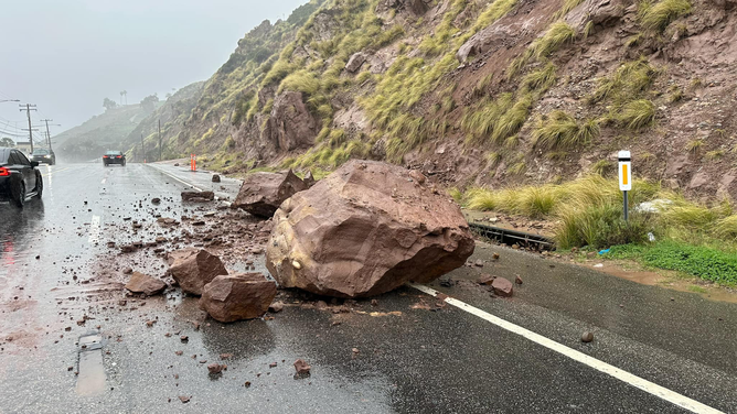 A photo showing large boulders that crashed onto the Pacific Coast Highway in Malibu on Monday, Feb. 19, 2024.