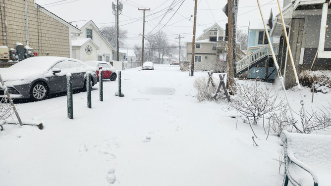 Snow is seen covering roads and sidewalks in Milford, Connecticut, during a nor'easter on Tuesday, Feb. 13, 2024.