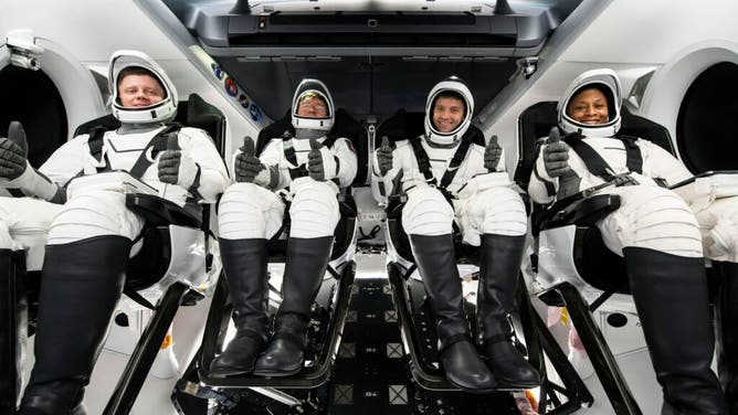 From left to right, Roscosmos cosmonaut Alexander Grebenkin, and NASA astronauts Michael Barratt, Matthew Dominick, and Jeanette Epps, wearing SpaceX spacesuits, are seen as they prepare to depart the Neil A. Armstrong Operations and Checkout Building for Launch Complex 39A during a dress rehearsal prior to the Crew-8 mission launch, Monday, Feb. 26, 2024, at NASA’s Kennedy Space Center in Florida.