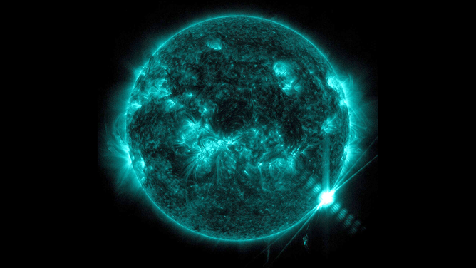 NASA’s Solar Dynamics Observatory captured this image of a solar flare – as seen in the bright flash on the lower right – on Feb. 9, 2024. The image shows a subset of extreme ultraviolet light that highlights the extremely hot material in flares, and which is colorized in teal. 