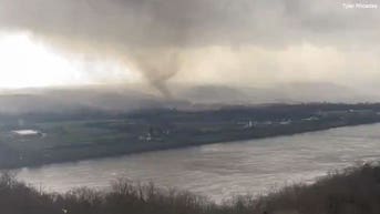 Tornado caught on video crossing river as threat for supercells continues