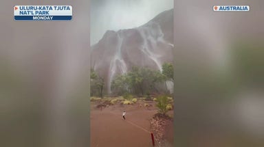 Watch: Heavy rain creates rare waterfalls over massive rock in Australia
