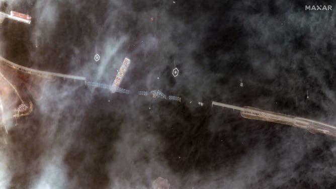 A MAXAR satellite image shows the Dali containership after crashing into the Francis Scott Key Bridge in Baltimore, Maryland on March 26, 2024.