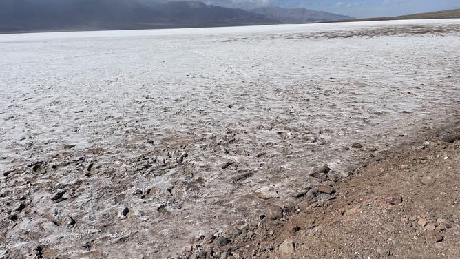 People were able to launch kayaks 10 feet from the road at this location until February 28. This photo, taken March 2, shows how far away from the road the lake moved during the windstorm. NPS/Abby Wines