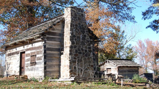Log Cabin in the fall at the Lincoln Living Historical Farm.
