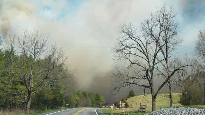 Photos show smoke and flames from the Peake Mountain and Bergton Fires in Rockingham County, Virginia on March 20, 2024.