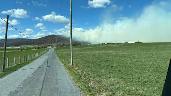 Photos show smoke and flames from the Peake Mountain and Bergton Fires in Rockingham County, Virginia on March 20, 2024.