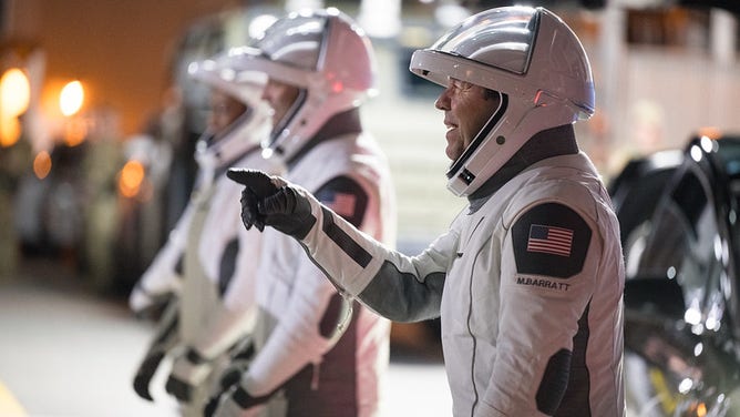 Roscosmos cosmonaut Alexander Grebenkin, NASA astronauts Jeanette Epps, Matthew Dominick, and Michael Barratt speak with family and friends as they prepare to depart the Neil A. Armstrong Operations and Checkout Building for Launch Complex 39A to board the SpaceX Dragon spacecraft for the Crew-8 mission launch, Sunday, March 3, 2024, at NASA’s Kennedy Space Center in Florida.