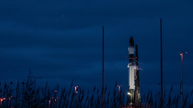 Rocket Lab's Electron rocket stands at Launch Complex 2 in Virginia ahead of the NROL-123 launch.