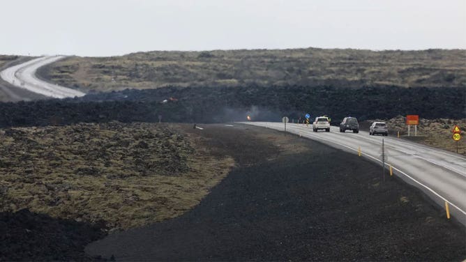 Emergency services are seen near to the site of the volcanic eruption on March 17, 2024 in Grindavik, Iceland. The Icelandic Meteorological Office confirmed a volcanic eruption started between Stora Skogfell and Hagafell on Saturday evening, the fourth time since December. A state of emergency has been declared in and around the town of Grindavik and hundreds of holidaymakers have been evacuated from the popular Blue Lagoon spa, which lies a short distance northwest of the site of the volcano.