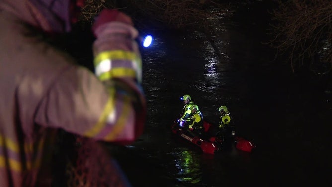 A team searches Chester Creek in Chester, Pennsylvania, on March 23, 2024.