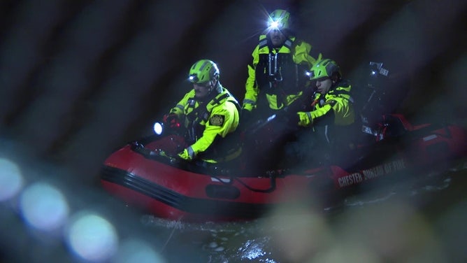 A team searches Chester Creek in Chester, Pennsylvania, on March 23, 2024.