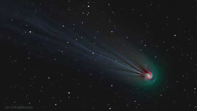 The featured image is a composite of three very specific colors, showing the comet's ever-changing ion tail in light blue, its outer coma in green, and highlights some red-glowing gas around the coma in a spiral. The spiral is thought to be caused by gas being expelled by the slowly rotating nucleus of the giant iceberg comet. (Image Credit & Copyright: Jan Erik Vallestad )