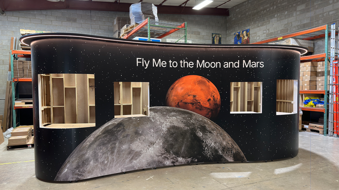 This photo shows a portion of the Fly Me to the Moon exhibit under construction ahead of its debut at Maine's Portland International Jetport (PWM).