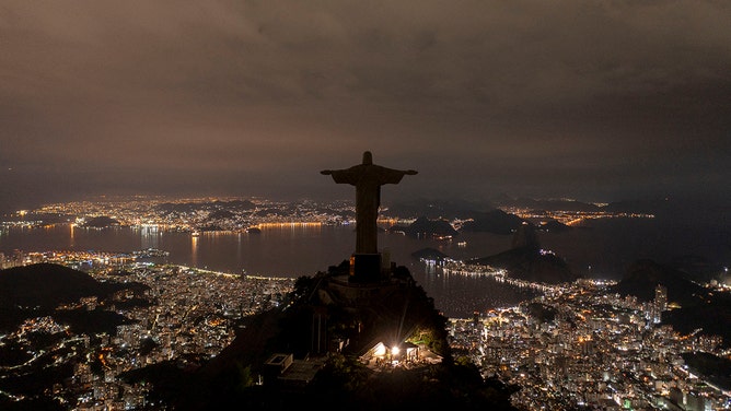 The statue of Christ the Redeemer is seen after being plunged into darkness for the Earth Hour environmental campaign on top of Corcovado hill in Rio de Janeiro, Brazil, on March 26, 2022.