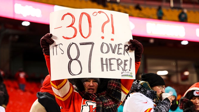 NFL fans cheer in the stands prior to an NFL Super Wild Card Weekend playoff game between the Miami Dolphins and the Kansas City Chiefs at GEHA Field at Arrowhead Stadium on January 13, 2024 in Kansas City, Missouri.