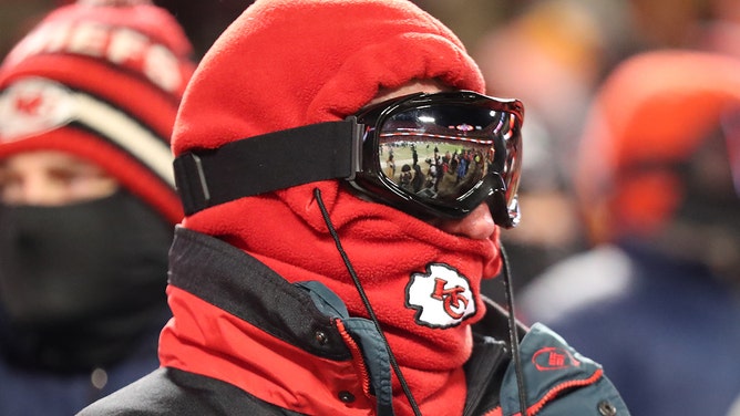A Kansas City Chiefs fan wears ski goggles to stay warm on a cold night during an AFC Wild Card playoff game between the Miami Dolphins and Kansas City Chiefs on Jan 13, 2024 at GEHA Field at Arrowhead Stadium in Kansas City, Missouri.