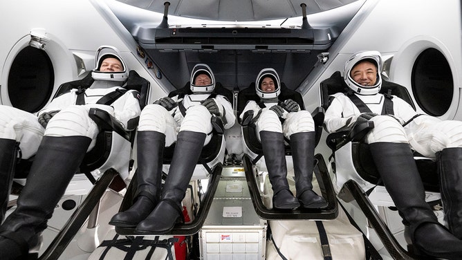 In this handout provided by the National Aeronautics and Space Administration (NASA), Roscosmos cosmonaut Konstantin Borisov, left, ESA (European Space Agency) astronaut Andreas Mogensen, NASA astronaut Jasmin Moghbeli, and Japan Aerospace Exploration Agency (JAXA) astronaut Satoshi Furukawa are seen inside the SpaceX Dragon Endeavour spacecraft onboard the SpaceX recovery ship MEGAN shortly after having landed in the Gulf of Mexico, on March 12, 2024 off the coast of Pensacola, Florida.