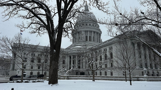 The beginning of spring has brought with it a snowy theme in Madison, Wisconsin, on Friday. The snowy weather has caused a difficult morning commute and travel complications for students trying to fly out for spring break.