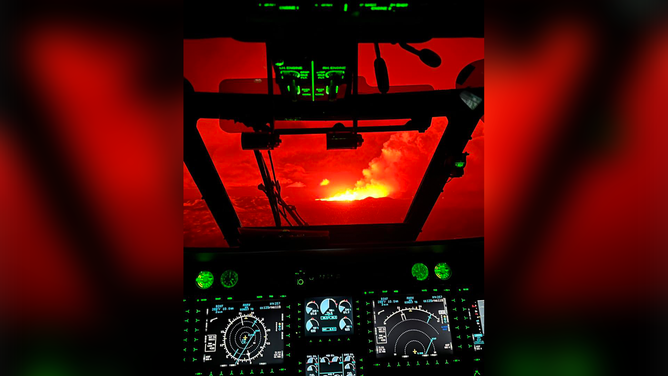 Lava is seen in the distance on board an Iceland Coast Guard helicopter on Saturday, March 16, 2024.