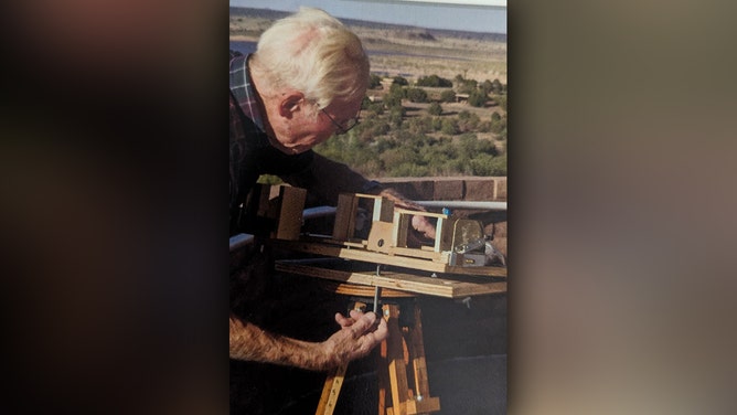 Laverne Biser prepares his equipment to observe a total solar eclipse in New Mexico in 1972.