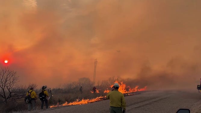 Firefighters actively suppress a new fire start on March 3, 2024, west of Sanford, Texas