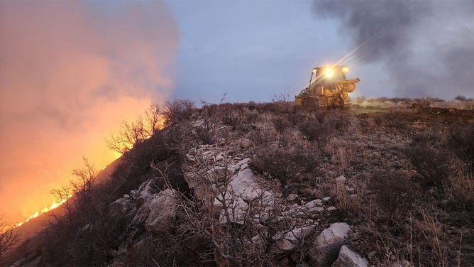 A tractor works to control the Smokehouse Creek wildfire in Hutchinson County, Texas, on Feb. 27, 2024.