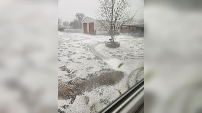 Hail covers ground in North Texas. Photo taken outside of Graford.