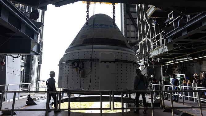 The Boeing Starliner spacecraft is lifted at the Vertical Integration Facility at Space Launch Complex-41 at Cape Canaveral Space Force Station in Florida on Tuesday, April 16, 2024. Starliner will be secured atop a United Launch Alliance Atlas V rocket for NASA’s Boeing Crew Flight Test to the International Space Station for the agency’s Commercial Crew Program. The spacecraft rolled out from Boeing's Commercial Crew and Cargo Processing Facility at NASA's Kennedy Space Center earlier in the day.