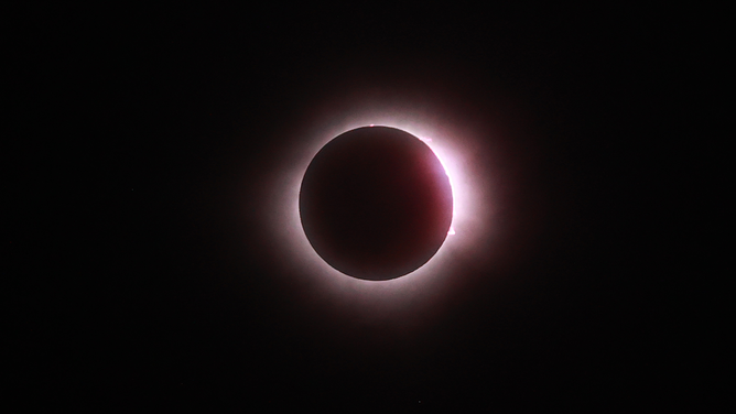 MAZATLAN, MEXICO - APRIL 08: The sun disappears behind the moon during the Great North American Eclipse on April 08, 2024 in Mazatlan, Mexico. Millions of people have flocked to areas across North America that are in the "path of totality" in order to experience a total solar eclipse. During the event, the moon will pass in between the sun and the Earth, appearing to block the sun. (Photo by Hector Vivas/Getty Images)