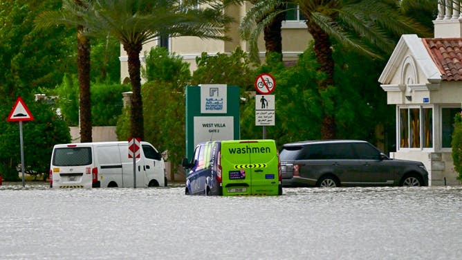 Vehicles are stranded on a flooded street following torrential rain in the Gulf Emirate of Dubai on April 16, 2024.