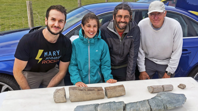 Part of the research team in 2020 examining the initial finds (at the back) of the new discovery made by Ruby and Justin Reynolds. Additional sections of the bone were subsequently discovered. From left to right, Dr Dean Lomax, Ruby Reynolds, Justin Reynolds and Paul de la Salle.