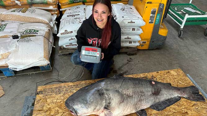 Jaylynn Parker, 15, and the 101-pound blue catfish she pulled in on a jugline on April 7, 2024. 