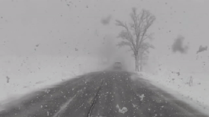This image shows heavy snow falling on Route 22 outside Burlington, Vermont, as a powerful nor'easter blasts through the Northeast and New England.