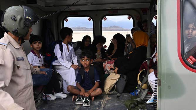 A photo showing children rescued by Royal Oman Police during ongoing flooding on April 15, 2024.