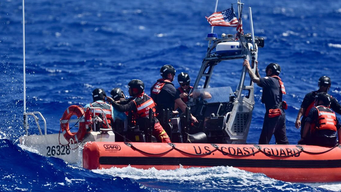 This image shows the U.S Coast Guard after successfully rescuing three men who were stranded on a remote island in the Pacific Ocean.