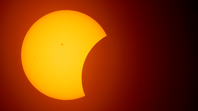 FORT WORTH, TEXAS - APRIL 8: The moon begins to eclipse the sun on April 8, 2024 in Fort Worth, Texas. Millions of people have flocked to areas across North America that are in the "path of totality" in order to experience a total solar eclipse. During the event, the moon will pass in between the sun and the Earth, appearing to block the sun. (Photo by Ron Jenkins/Getty Images)