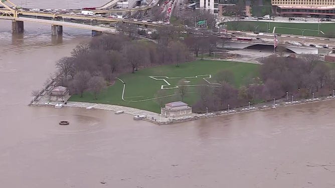 Due to constant rain, the area around the Point State Park Fountain in Pittsburgh, where three rivers (Ohio, Allegheny and Monongahela) meet, has flooded on Thursday, April 4, 2024. The river rose from the ground and spilled into the fountain. People are no longer able to walk around the fountain along the riverside.