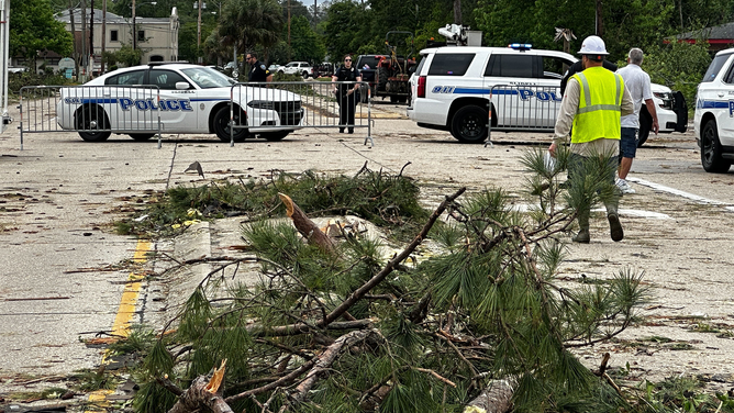 Debris is seen in the middle of a road in Slidell, Louisiana, one day after a tornado tore through the community.