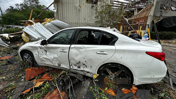 A car was heavily damaged after a tornado in Slidell, Louisiana, on Wednesday, April 10, 2024.