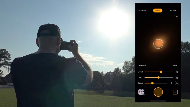 Jeremy Veldman, with the Memphis Astronomical Society, tests the Solar Snap filer and app.