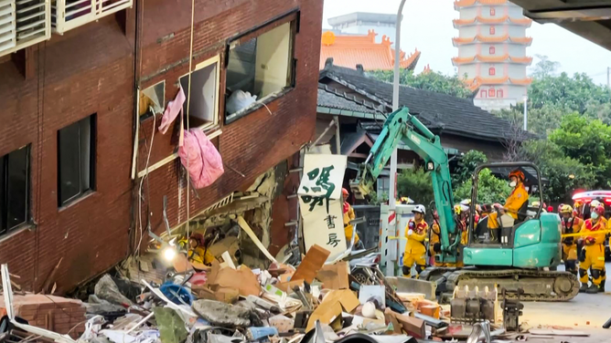 This frame grab from AFPTV video taken on April 3, 2024 shows rescue workers searching for survivors at the damaged Uranus Building in Hualien, after a major earthquake hit Taiwan's east. A major 7.4-magnitude earthquake hit Taiwan's east on the morning of April 3, prompting tsunami warnings for the self-ruled island as well as parts of southern Japan and the Philippines. (Photo by AFPTV / AFP) (Photo by STR/AFPTV/AFP via Getty Images)